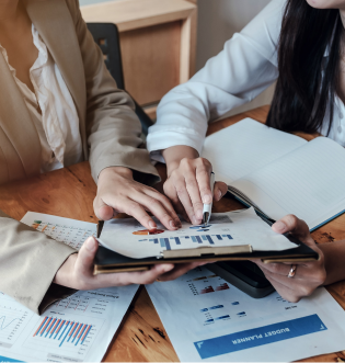 2 women looking over sales figures