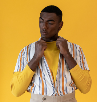 african american man holding yellow shirt