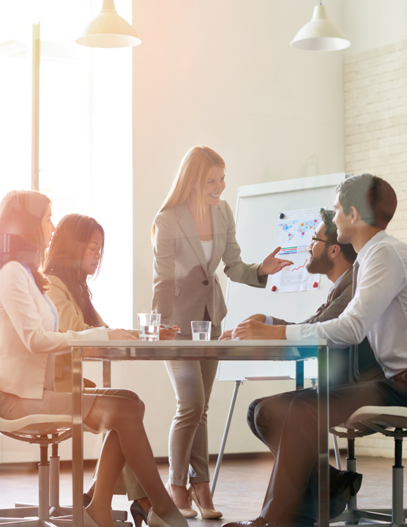 Woman presenting to her co-workers