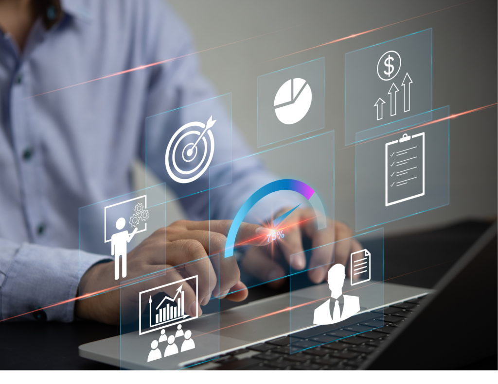 Man on computer typing with holographic icons showing