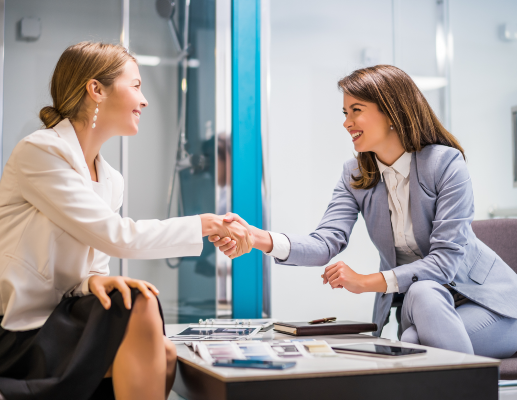 2 Women shaking hands