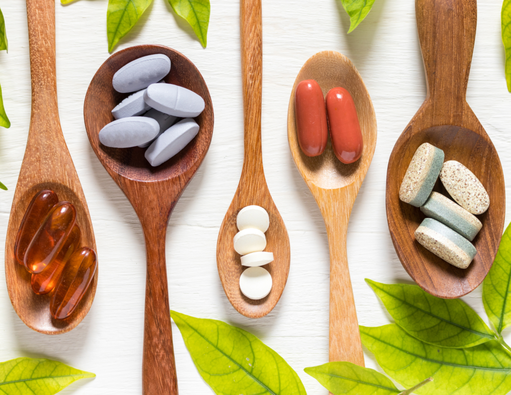 wooden spoons with supplements on them