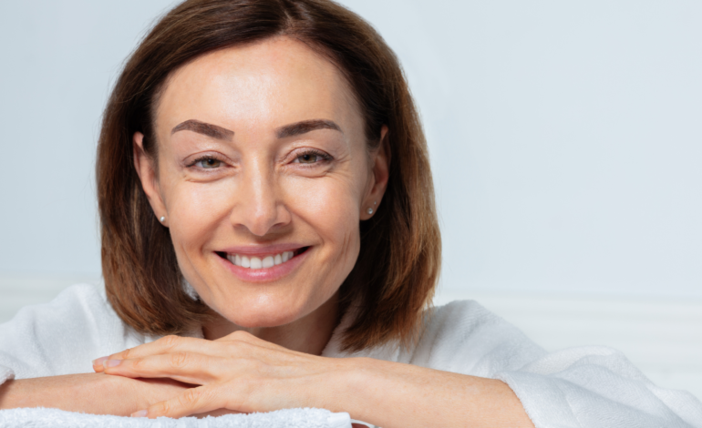 Woman hands folded on towel