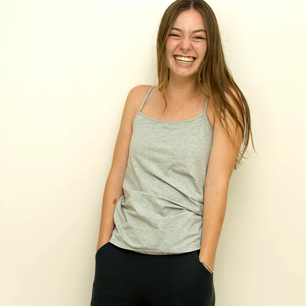 girl smiling wearing Long Pant and tank