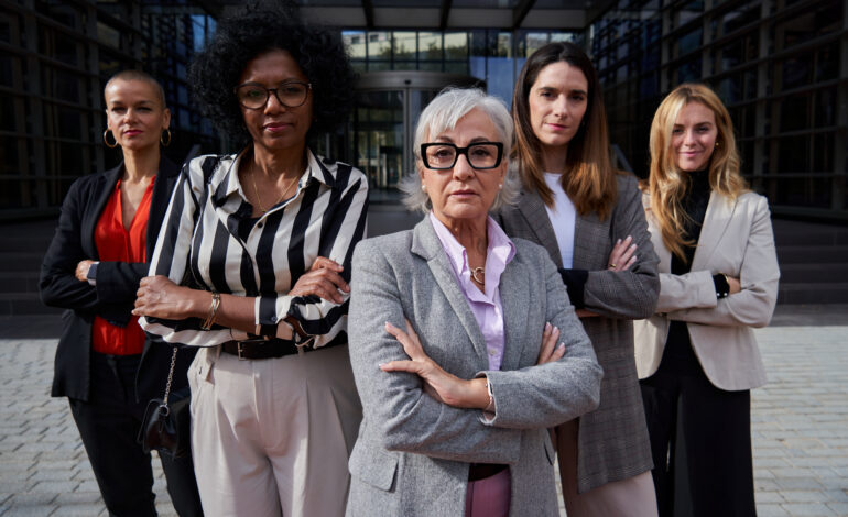 Confident group of multiethnic businesswomen looking at camera seriously.