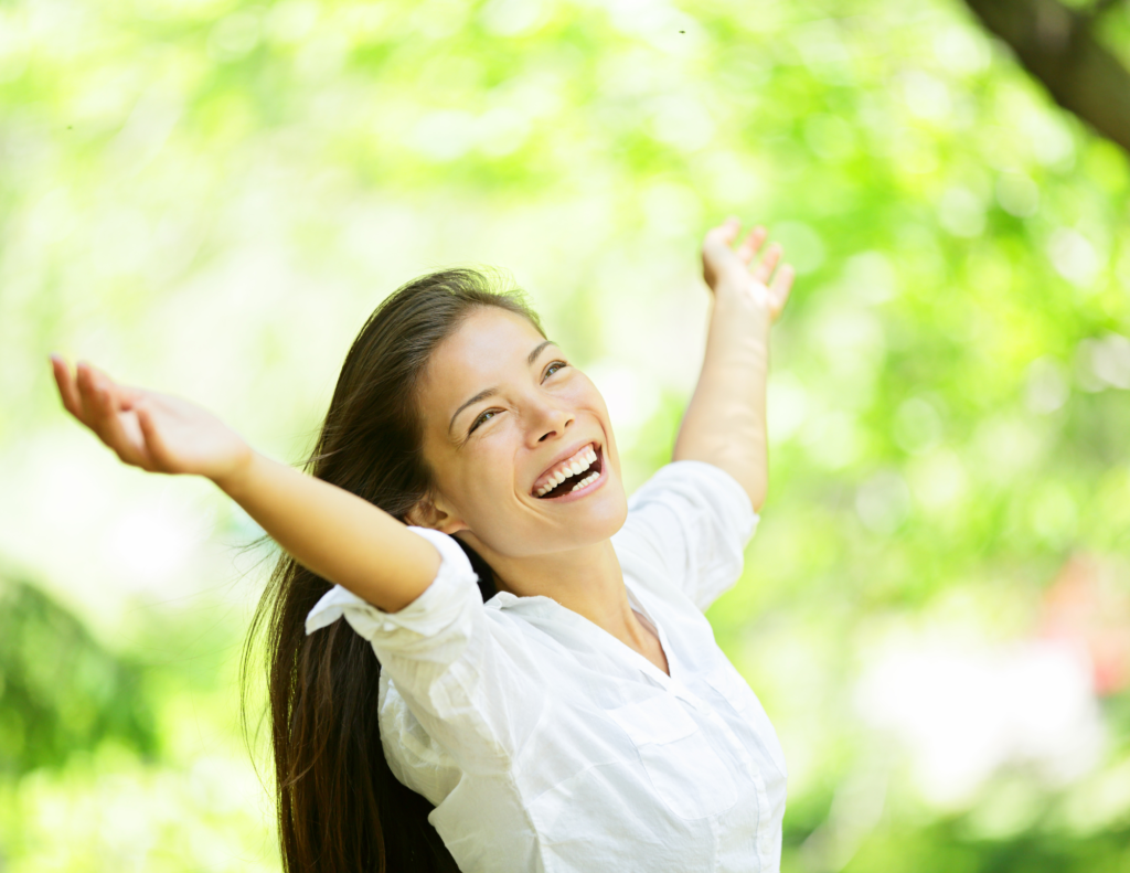 woman happy with arms open