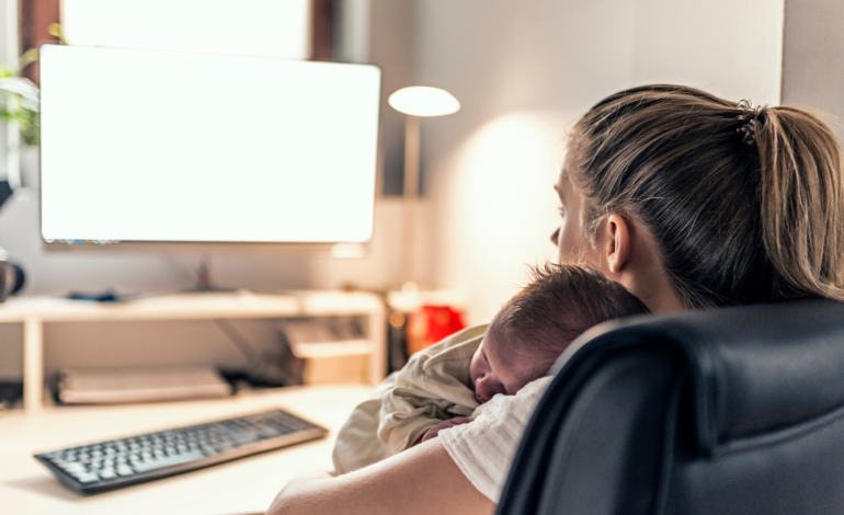 Mom at computer with baby