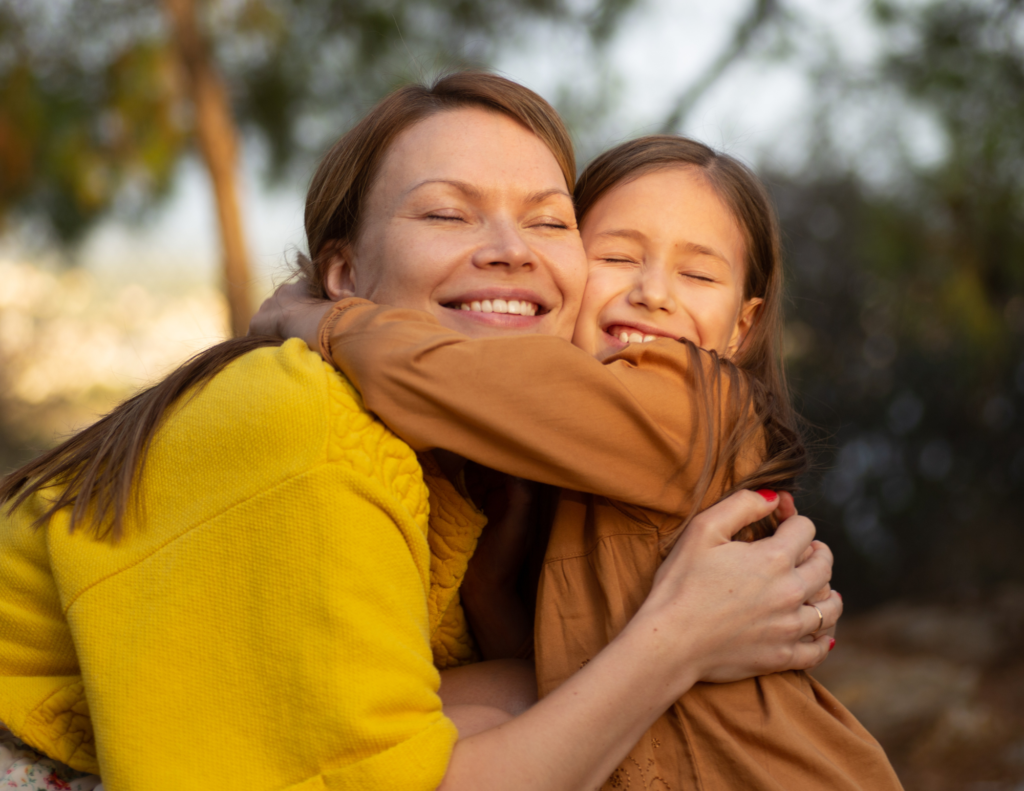 woman hugging daughter