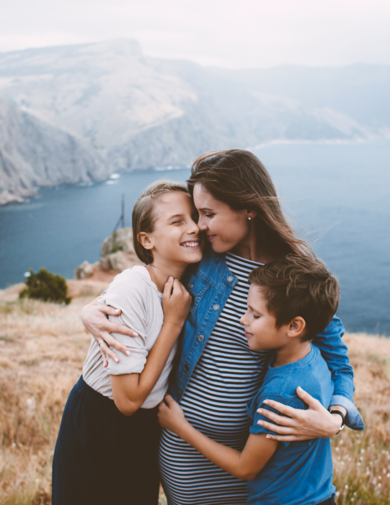 Woman hugging children