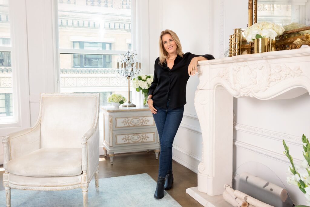 Starla with elbow up on fireplace mantle