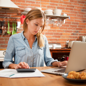 Female doing calculations for budgeting