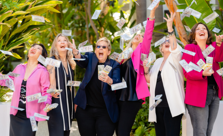 Catherine Gray and Women smiling and cheering and throwing up money in the air