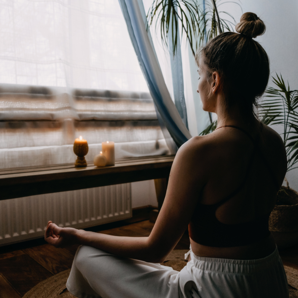 woman doing self care through yoga