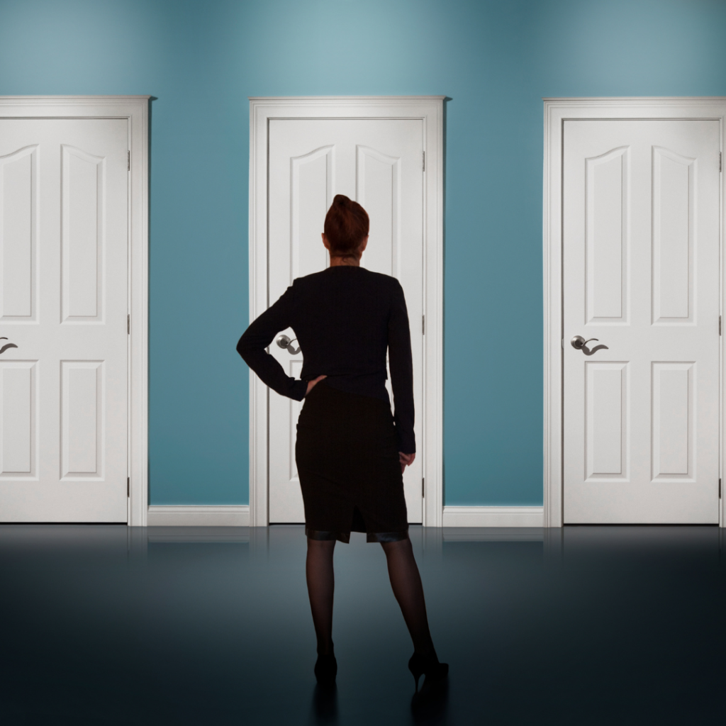 woman standing in front of three doors