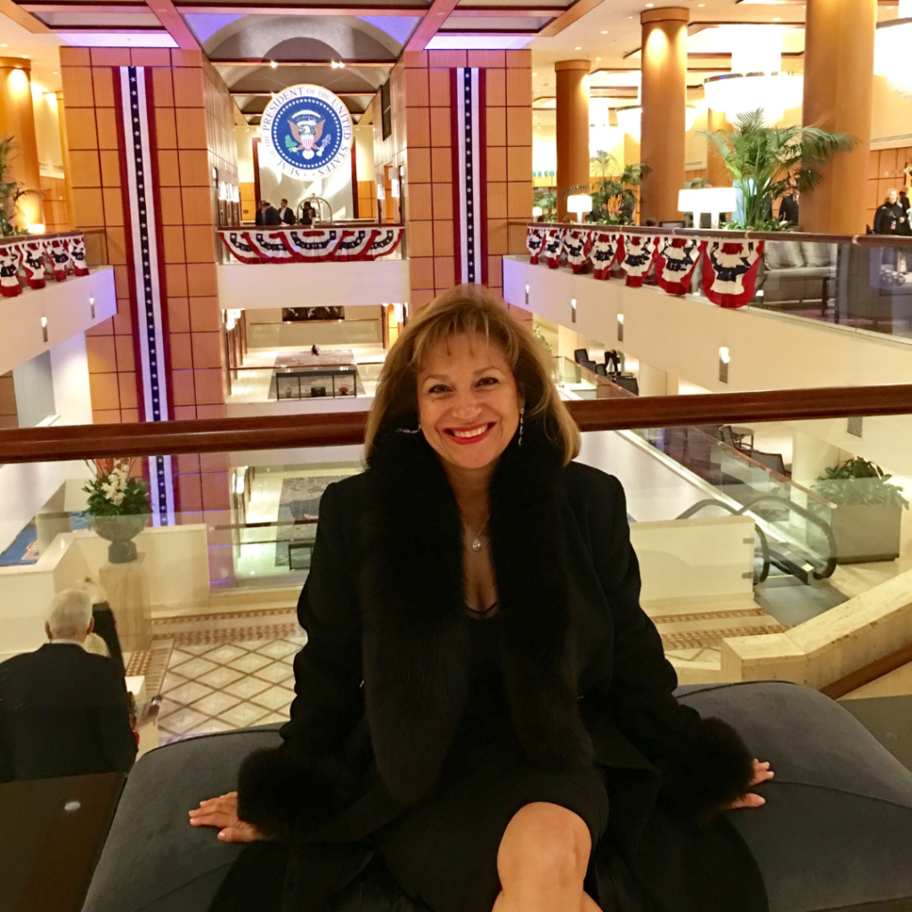 Betty Uribe smiling at camera at a presidential event