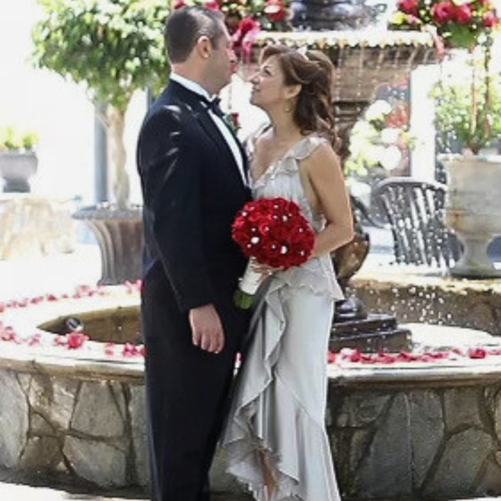 Betty Uribe with husband in wedding photo