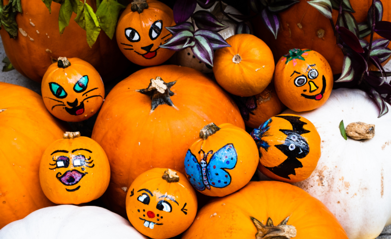 pumpkins with painted faces on them