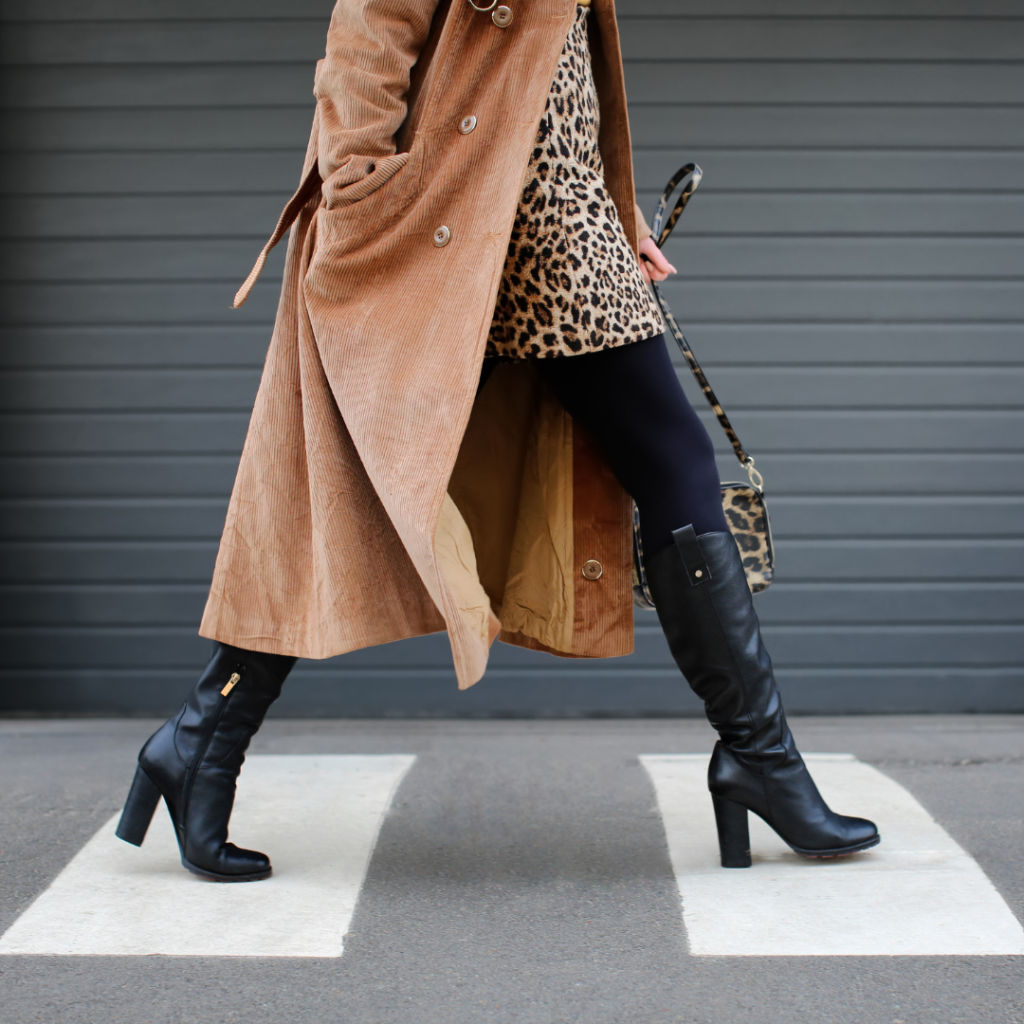 fashionable woman walking in boots