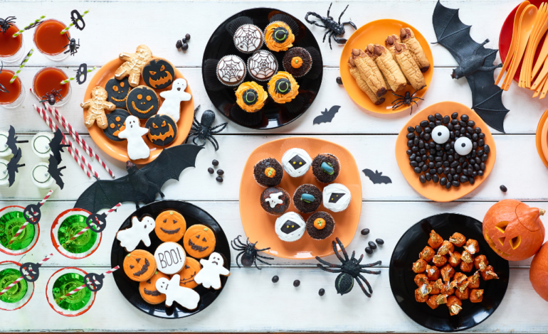 table full of halloween sweet treats