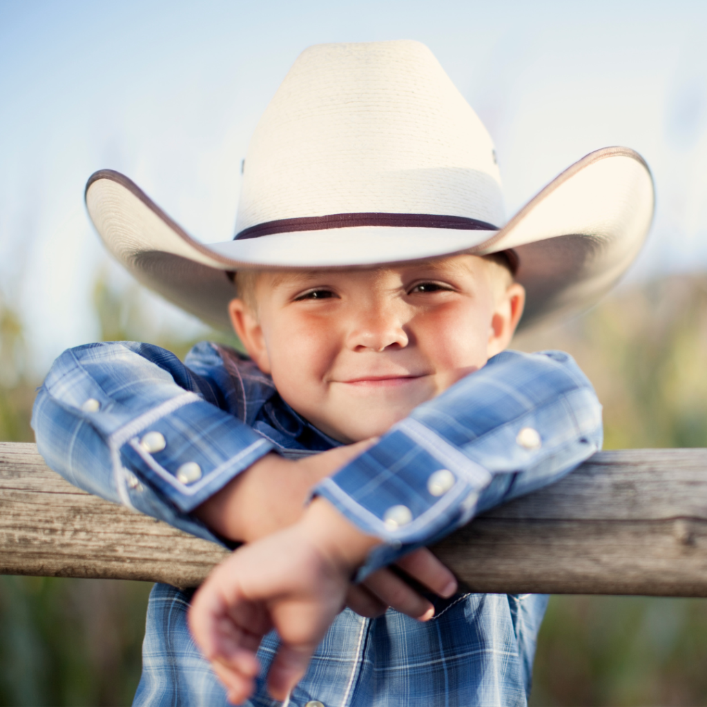 little boy dressed like cowboy