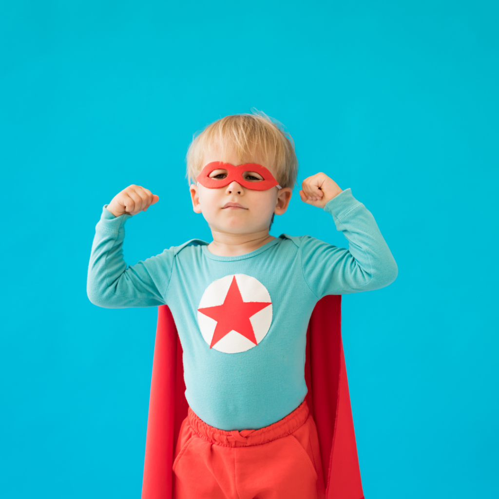 little boy in superhero costume