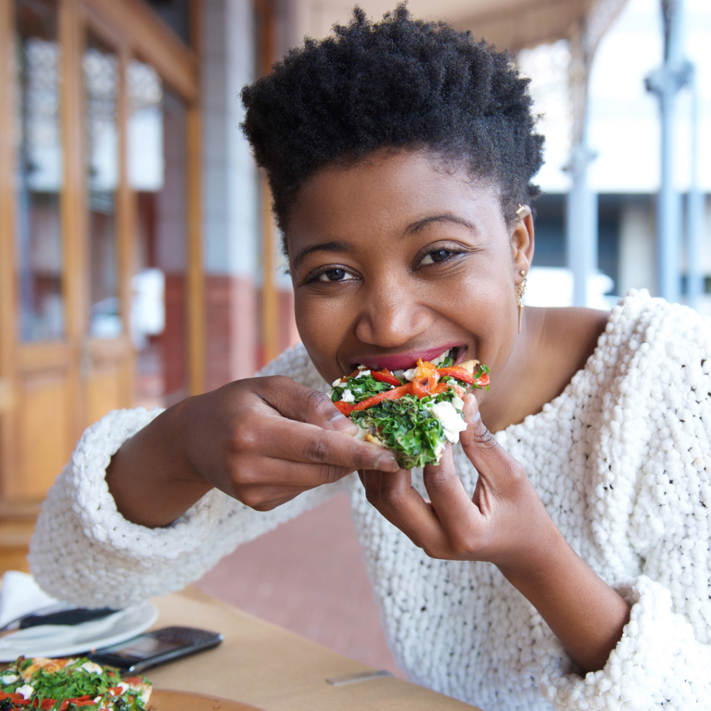 woman happily eating