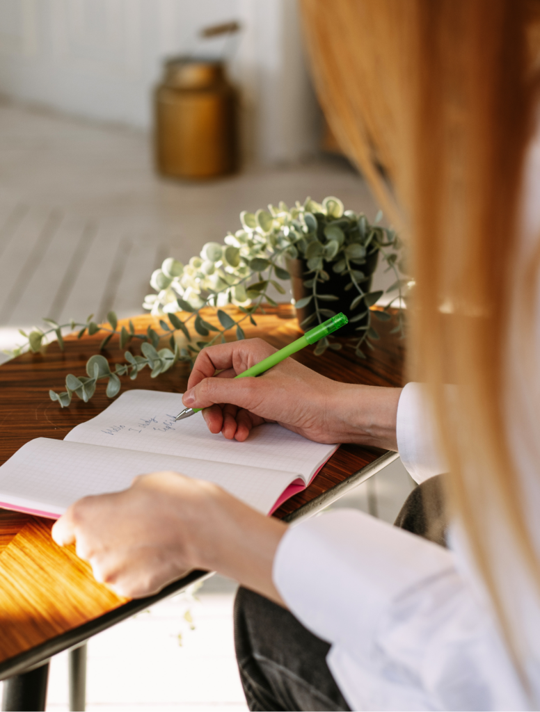 Woman writing in journal