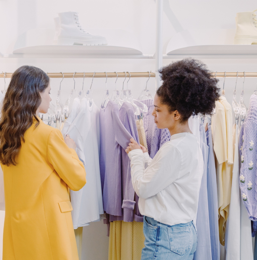 Female stylist picking outfits for another woman