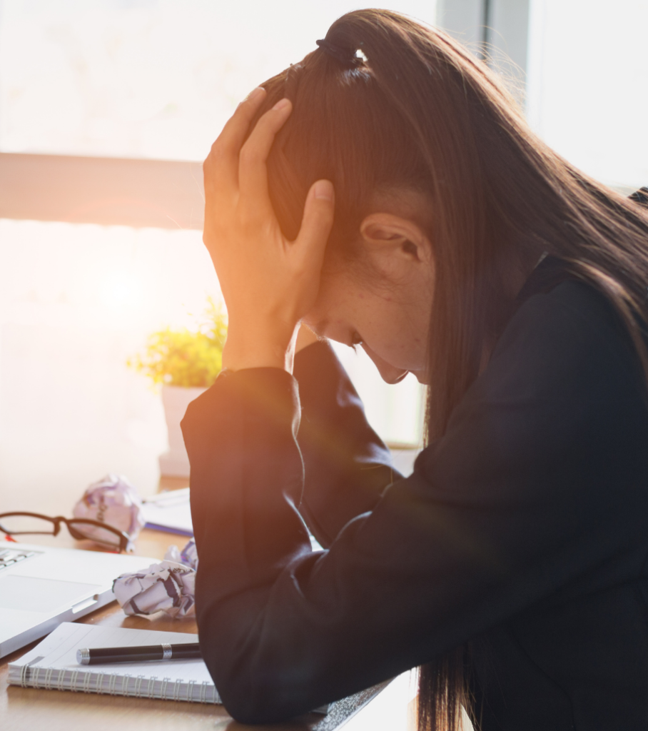 Female with hands on head frustrated