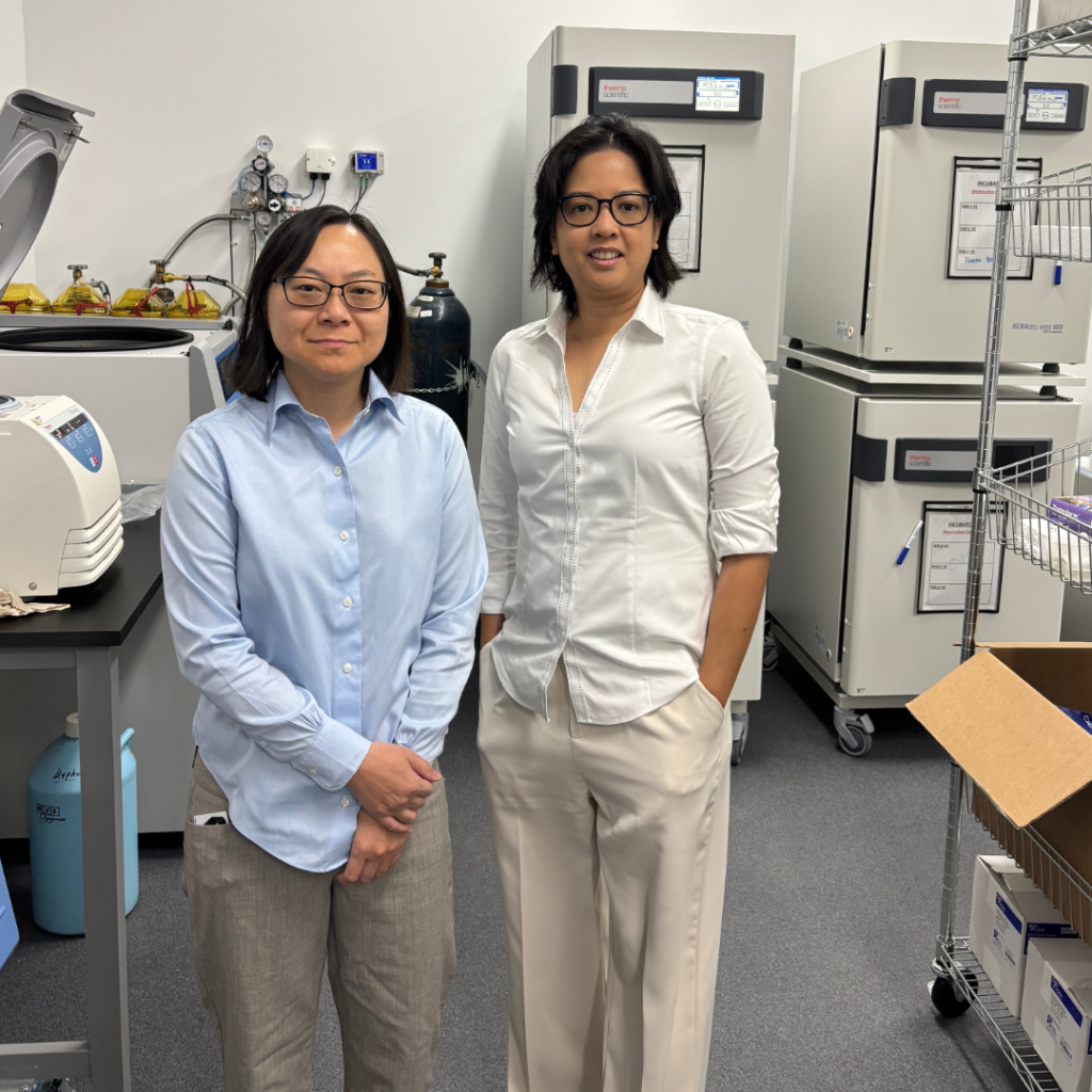 MyPhuong Le and Leah Villegas smiling in lab