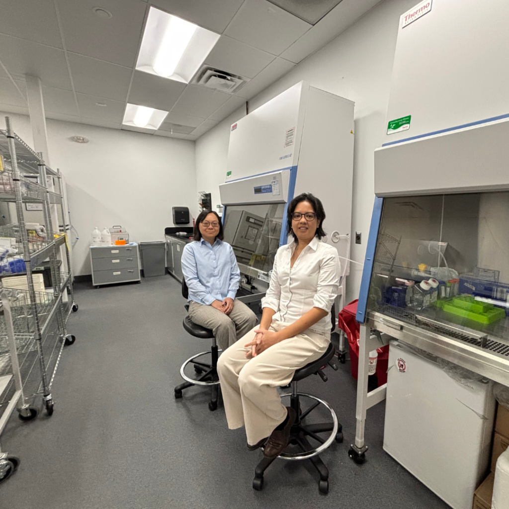 MyPhuong Le and Leah Villegas sitting in lab