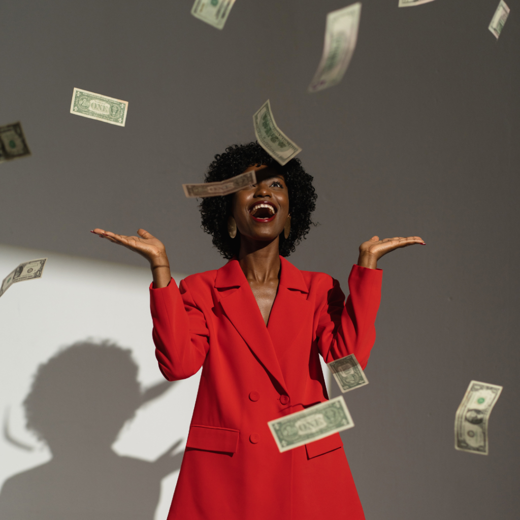 woman smiling with money falling