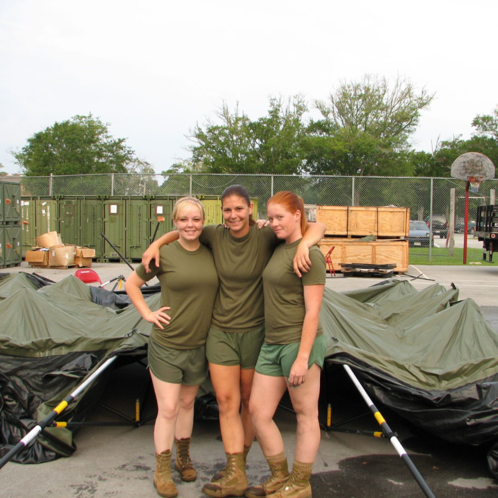 Dr. Moriah Thomas with fellow soldiers in military camp