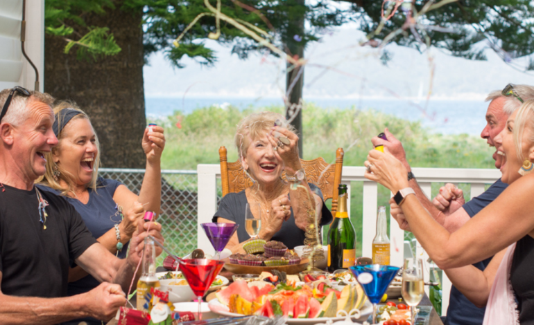 family celebrating holiday at table