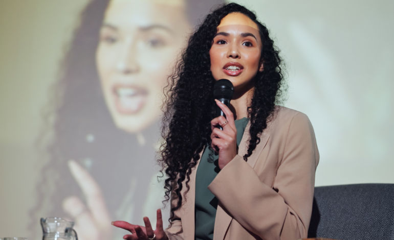 Black woman speaking on stage