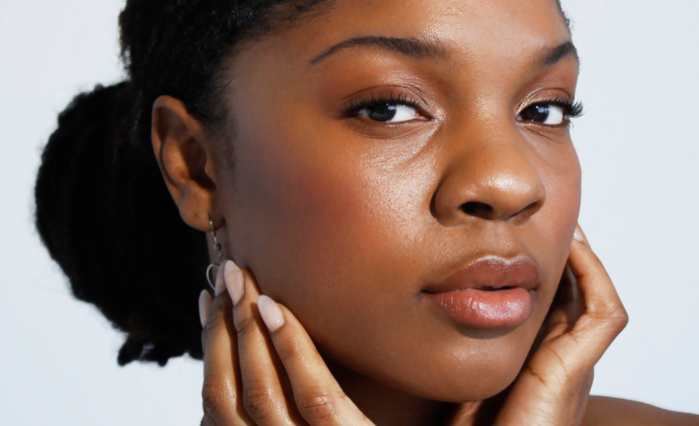 Black Woman showing off make up