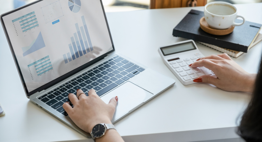 Woman working on computer and finances