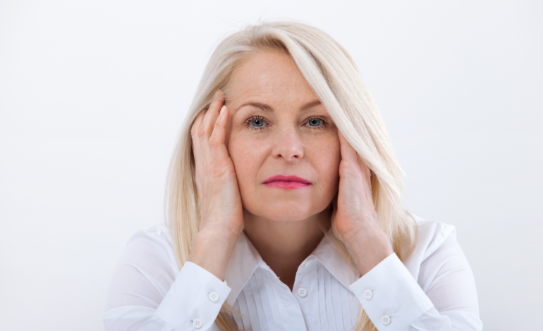 Woman Looking forward with hands on cheeks