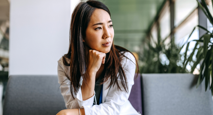 Woman Looking out with fist on chin