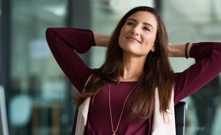 Woman manifesting her destiny from her desk