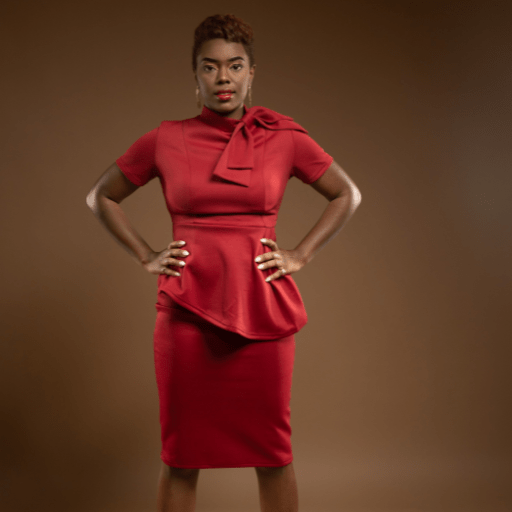 Black woman in red with hands on hips