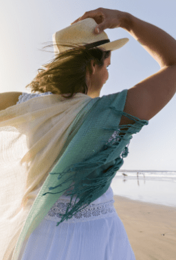 Woman with flowing clothes at beach