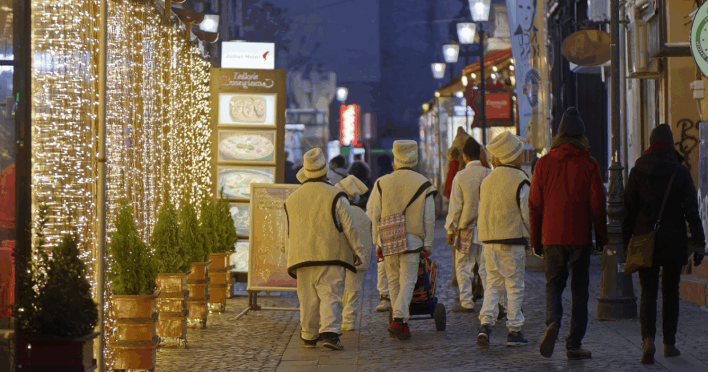 Christmas in Romania with men in white suits and hats